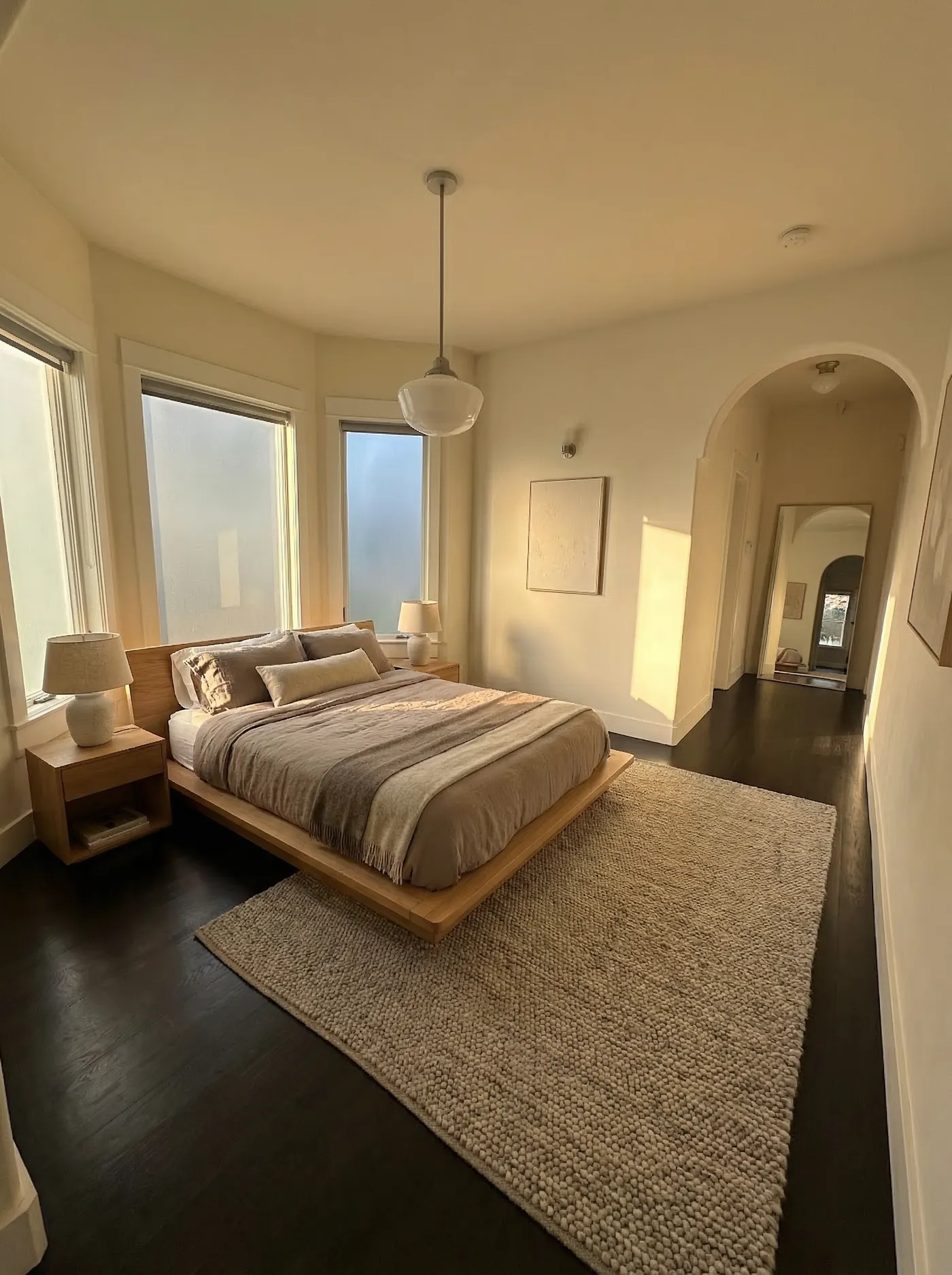 Bedroom of The Conservatory, a light-filled suite at The Leschi Collection